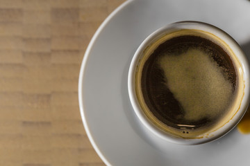 Coffee Espresso on a white plate and wooden background