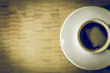 Coffee Espresso on a white plate and wooden background