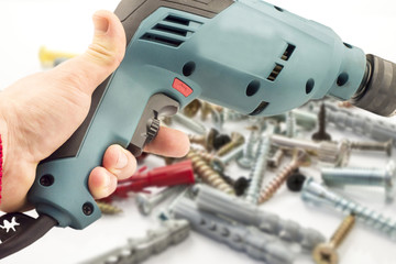 Electric drill in hand