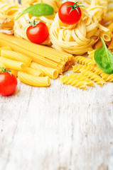 different pasta with tomatoes and spinach