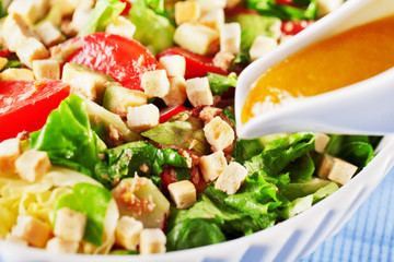 Salad with tomatos, tuna fish and croutons