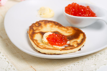 Pancake with salmon caviar