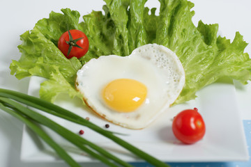 Fresh breakfast Fried egg with tomatoes cherry and salad
