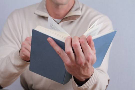 Man Reading A Book Close Up.