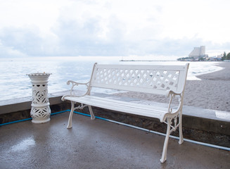 Art bench and ashtrays located on the beach