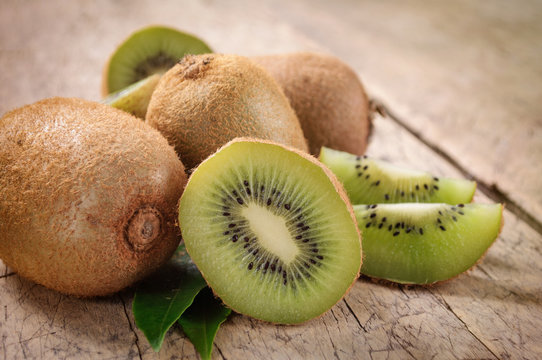 Kiwi fruit on brown wooden background