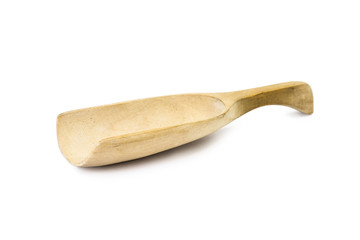 Close up of wooden spoon on white background seen from the side 