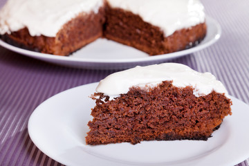 Fototapeta na wymiar Chocolate cake with white cream