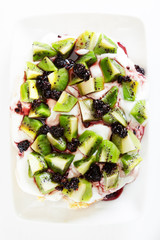 Pavlova with kiwi and berries