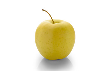 Golden Delicious apple on a white background