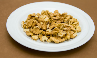 Walnuts Shelled on Brown Background