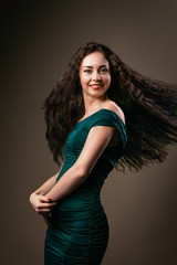 Fototapeta premium beautiful healthful curved girl waved her curly hair