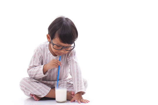 Happy boy drink milk.