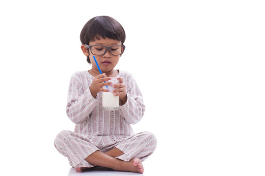 Little boy with a glass of milk