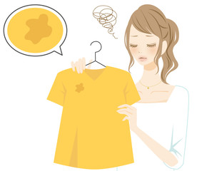 服の汚れにショックを受ける女性