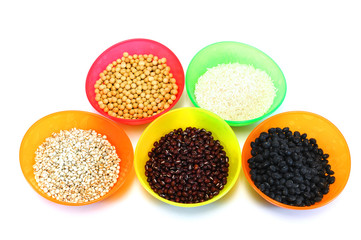 various beans and rice in colorful bowls