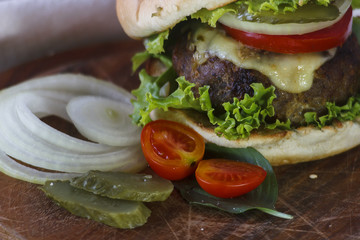 Still Life with a hamburger on a black table