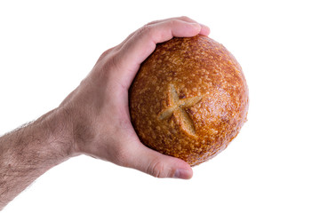 Clean male hand grasping a sourdough bun