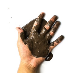 Hands with mud on white