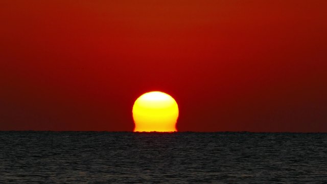 sea sunrise - shot with telephoto lens, timelapse, 4k

