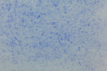 Blauer gesprenkelter Pastellfarbener Hintergrund.