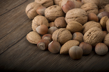 Fresh group of nuts  on the wooden table