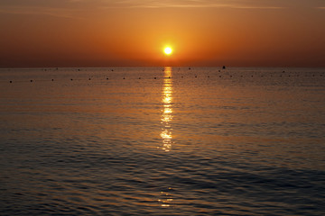 Naklejka premium orange sunset over the sea