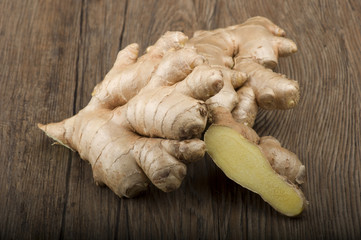 Ginger root sliced on the wooden table