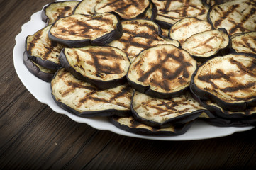 Aubergines eggplants and slices grilled on the plate