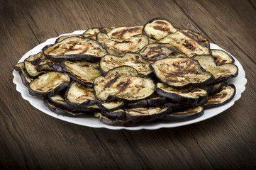 Aubergines eggplants and slices grilled on the plate