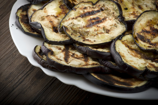 Aubergines eggplants and slices grilled on the plate