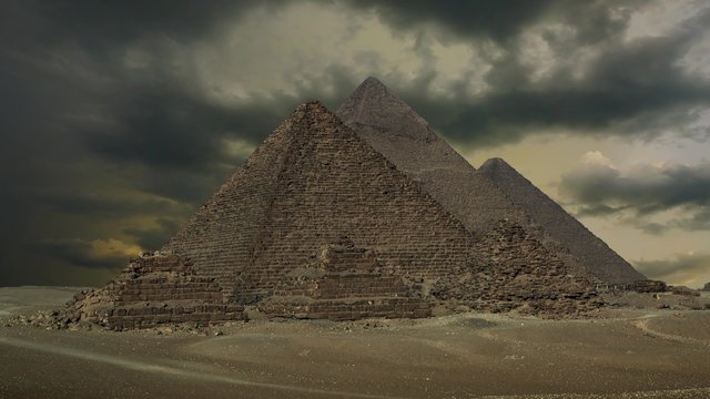 Timelapse with sunset clouds over great pyramids at Giza Cairo in Egypt , 4k
