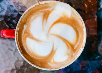 frangipani flower on the Cup of art latte