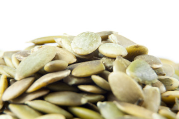 Closeup View of Pumpkin Seeds on a Plain Background