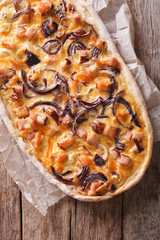  flammkuchen close-up on a paper. vertical top view
