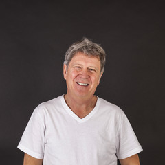 Obraz premium smiling happy casual dressed man in studio