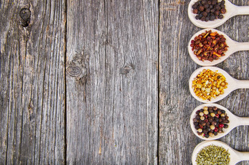 Obraz na płótnie Canvas Spices on wooden spoons