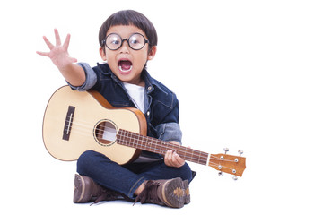 Cute boy playing the ukulele on white background 
