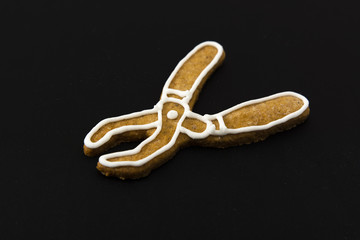 gingerbread cookies decorated with sugar tongs