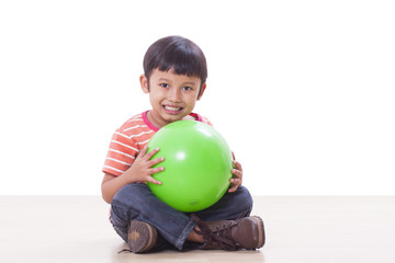 Fototapeta premium Little boy playing green ball 