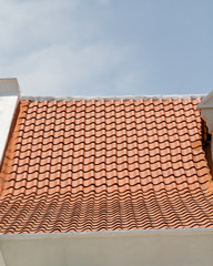 New Roof Tiles on Old White Plaster