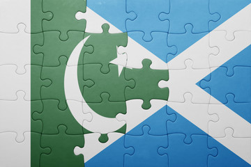 puzzle with the national flag of pakistan and scotland