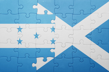 puzzle with the national flag of honduras and scotland
