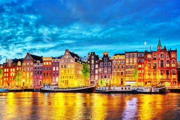 Fototapeta na wymiar Famous Amstel river and night view of beautiful Amsterdam city.