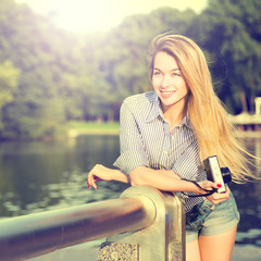 Portrait of Fashion Hipster Girl with Photo Camera