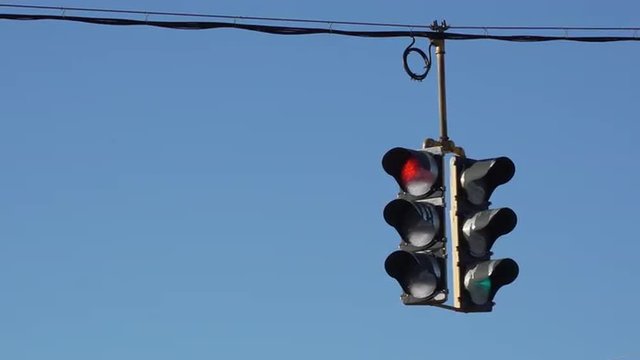 Traffic light hangs over a typical  U.S. roadway.