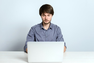 Young man working at laptop