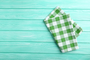 Obraz premium Napkin on mint wooden table, close up