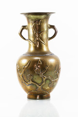 Antique brass vase on white background