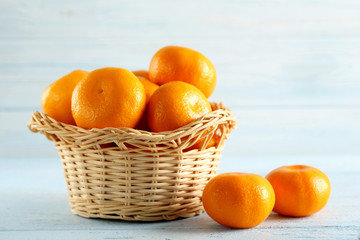 Ripe mandarins on a blue wooden table